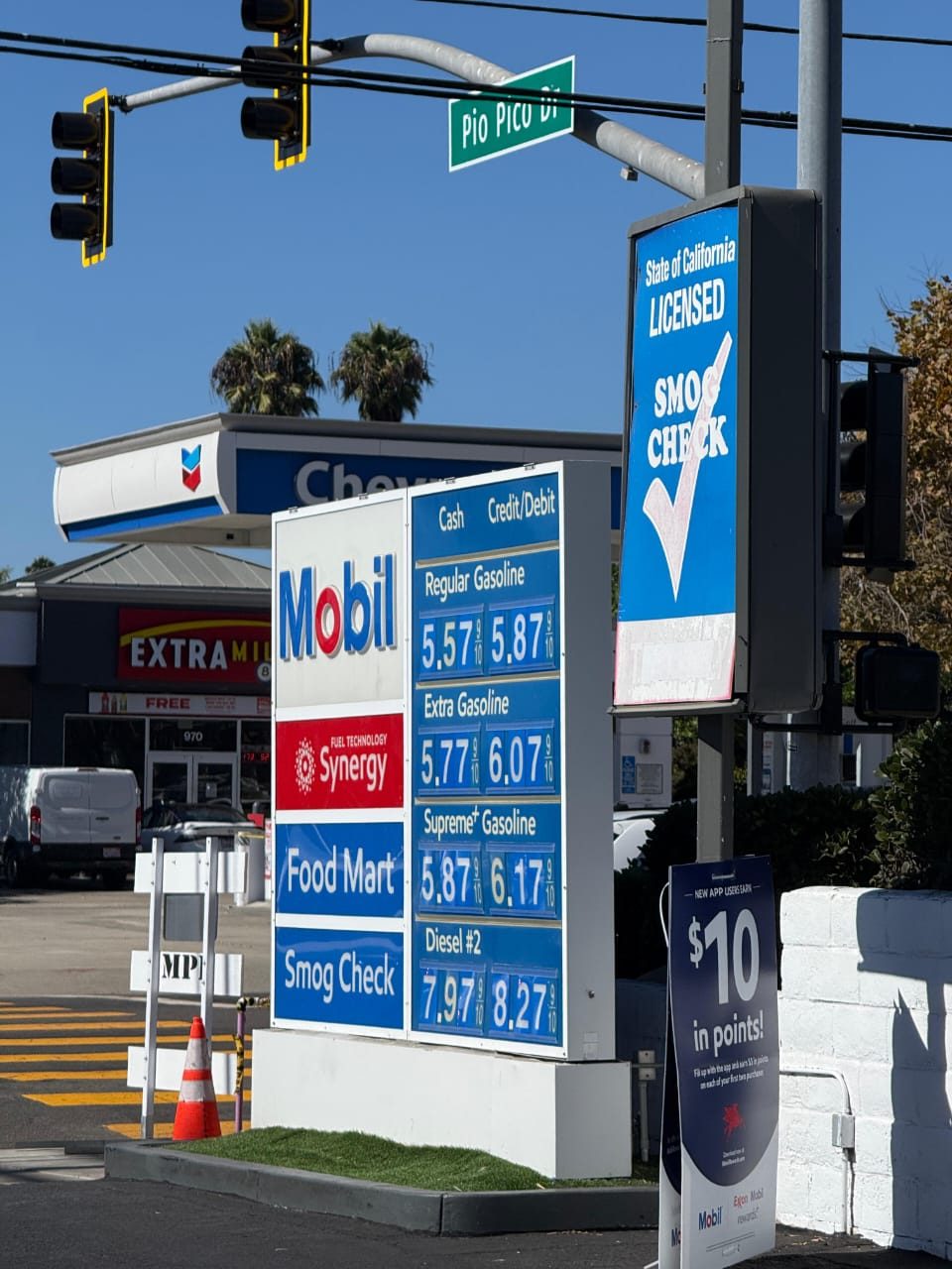 Mobil Synergy gas price board and State of California Licensed Smog Check sign at Tamarack Ave and Pio Pico Dr